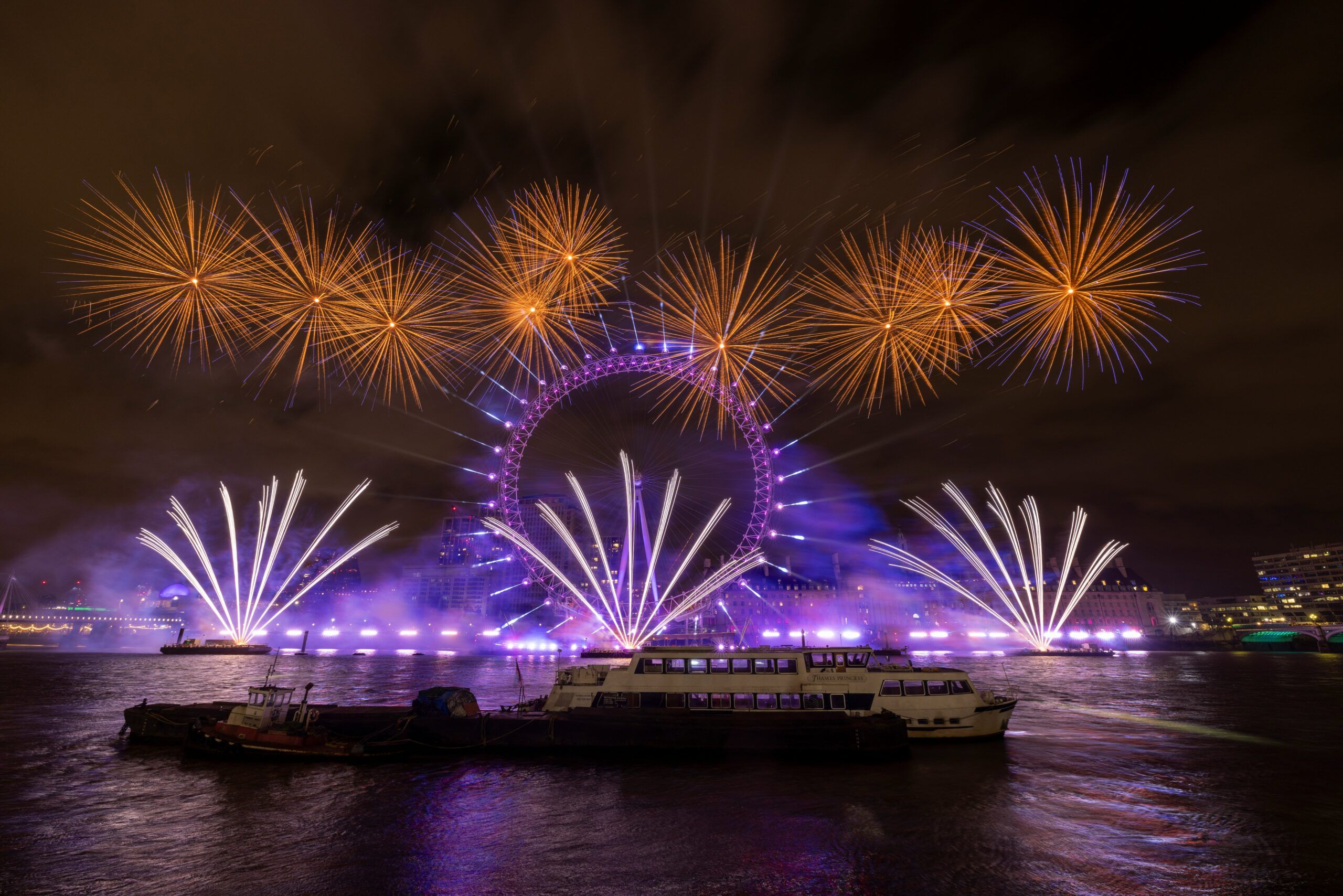 London eye at night with fireworks
